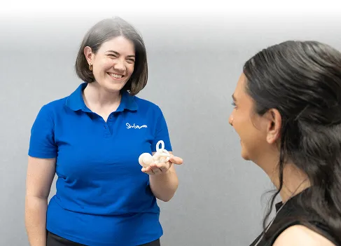 Audiologist performing hearing assessment