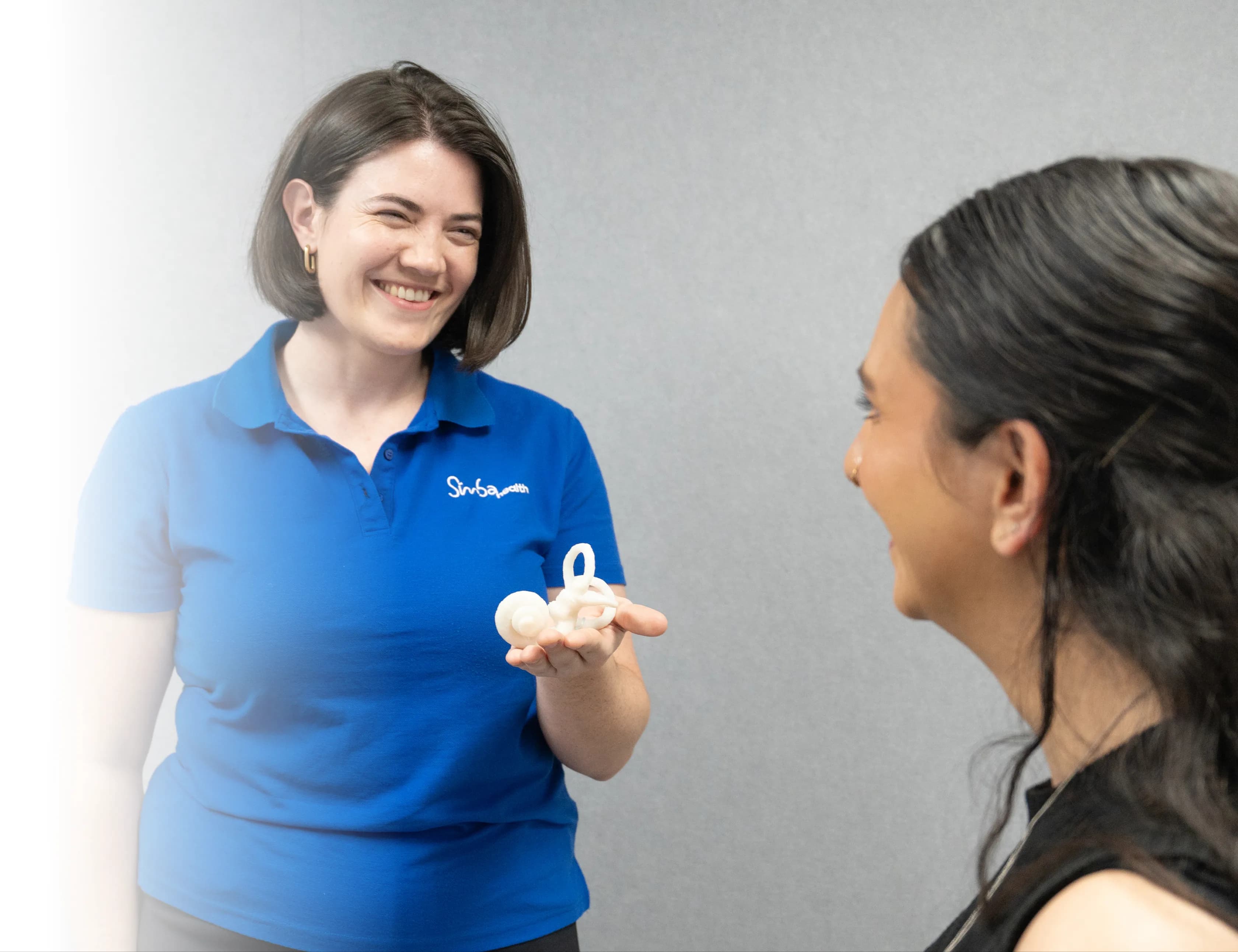 Audiologist performing hearing assessment