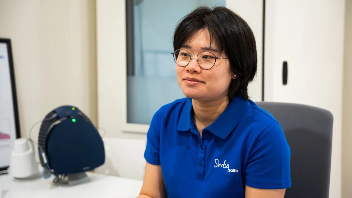A Simba Health audiologist discussing hearing device options with a patient