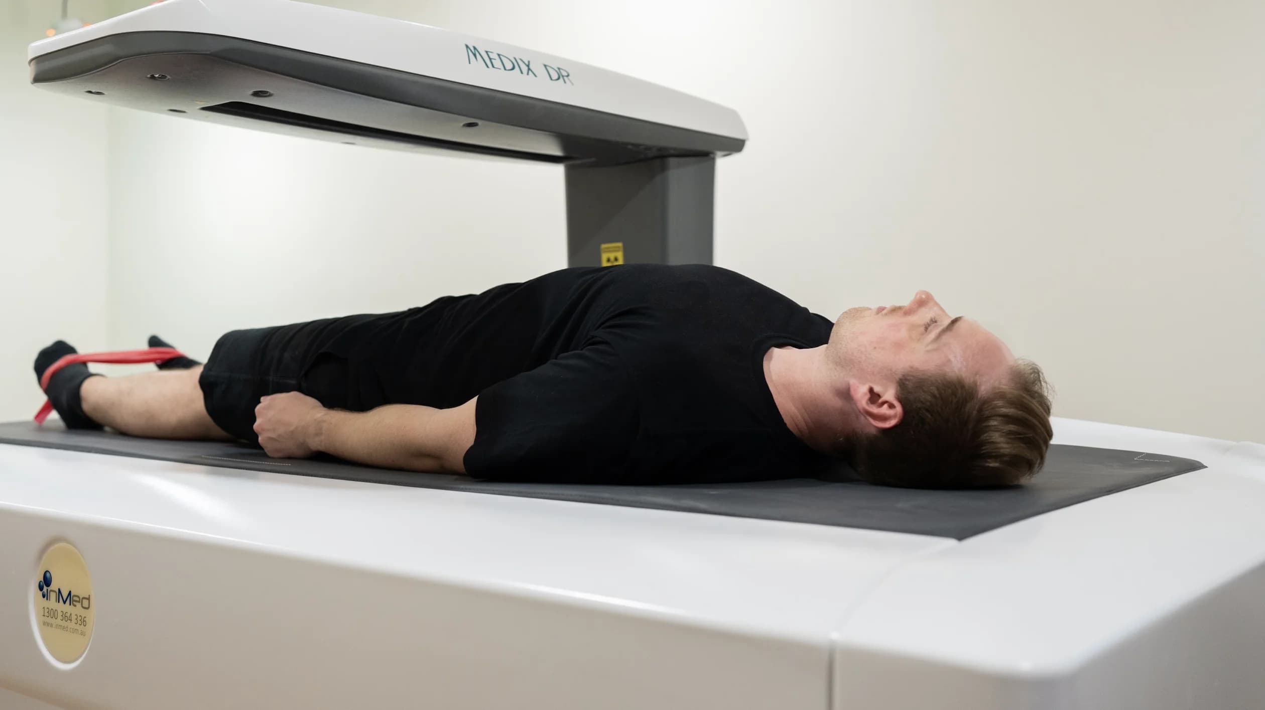 Patient undergoing DEXA body composition scan at Simba Health