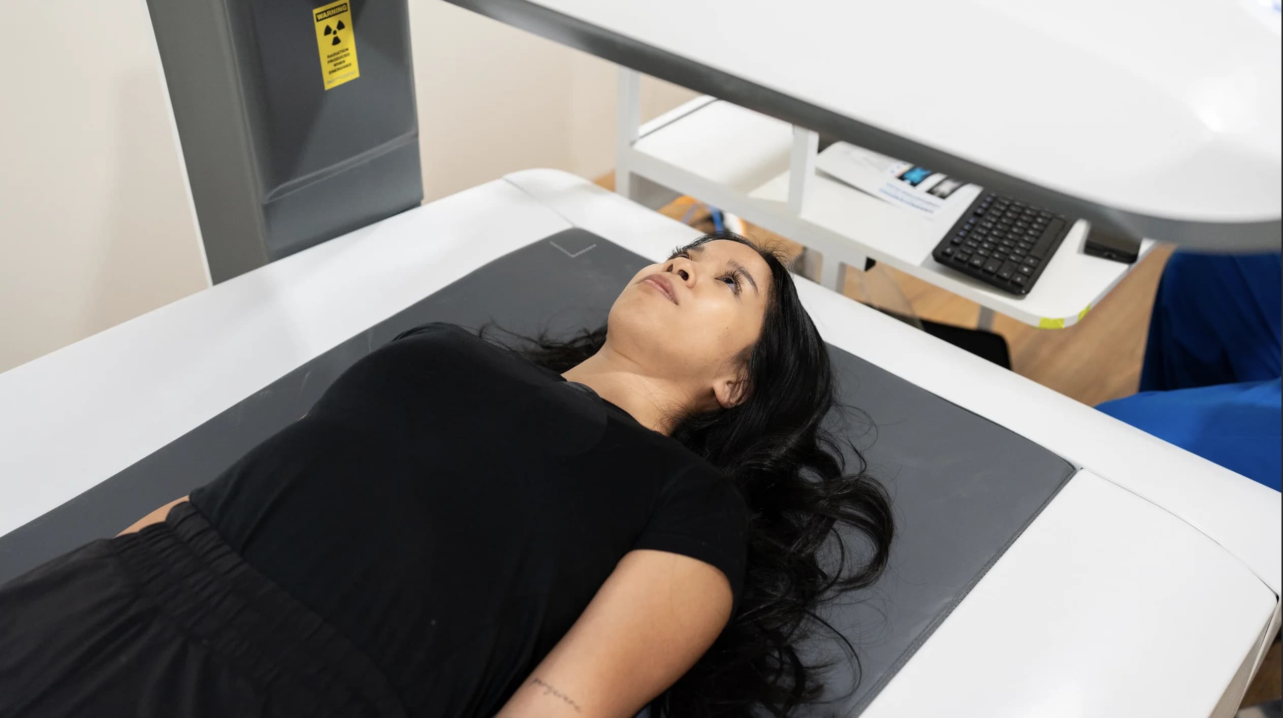 Patient undergoing a DEXA body composition scan at Simba Health