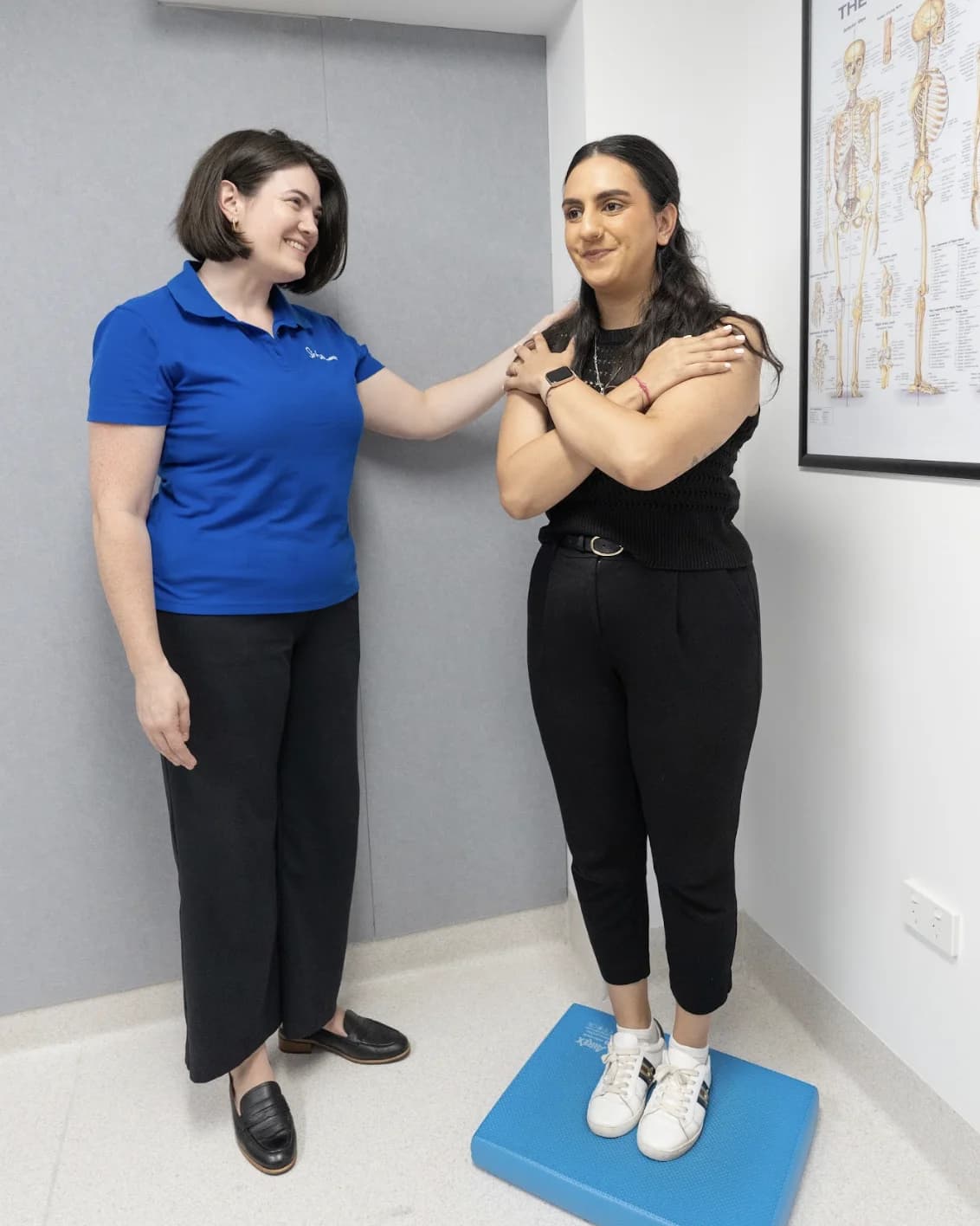 Simba Health physiotherapist assessing patient posture